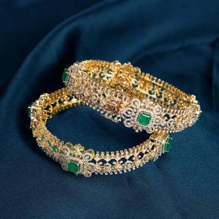 Diamond bangles with emeralds