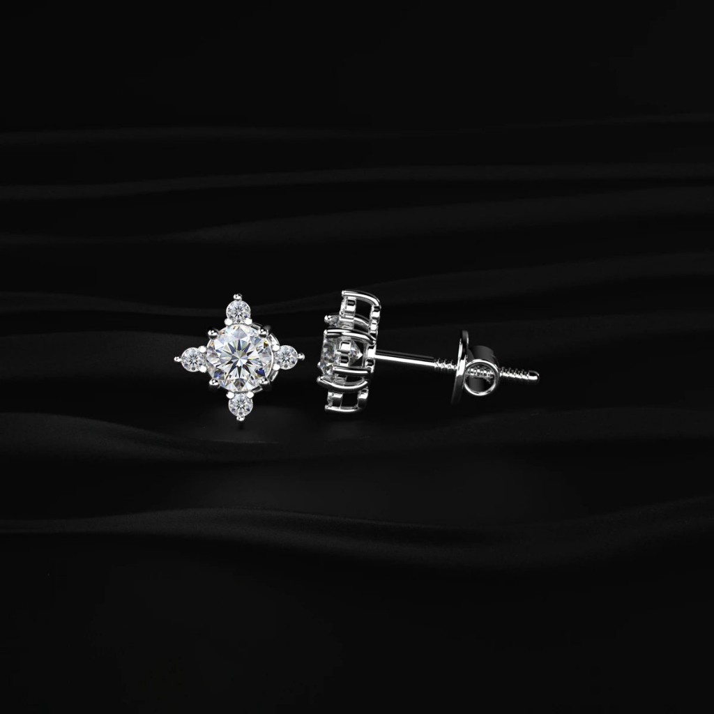 Diamond stud earrings from Elyra on a black background